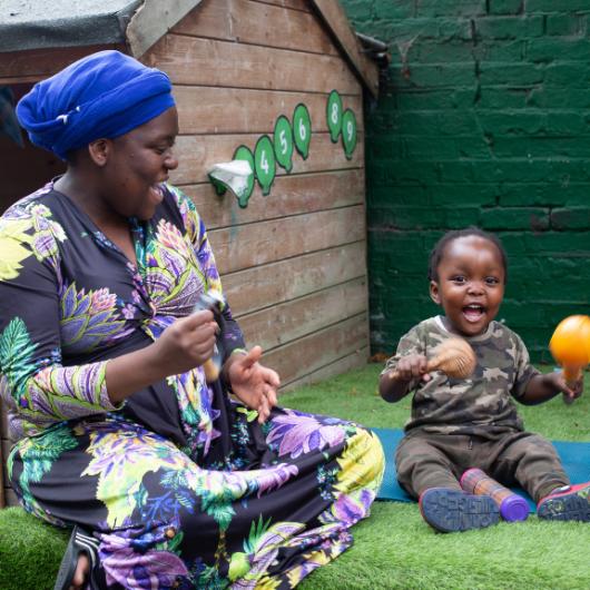 Teacher and child playing instruments