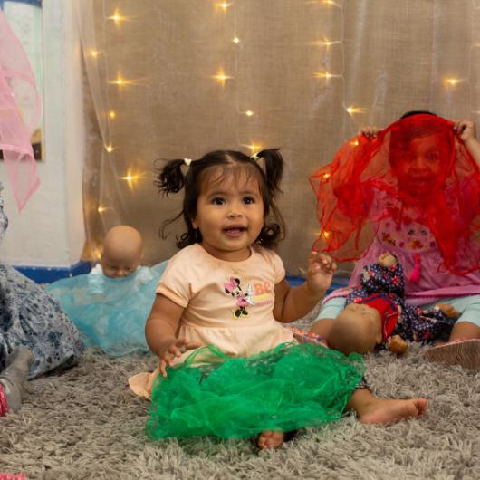 Baby playing with fabrics