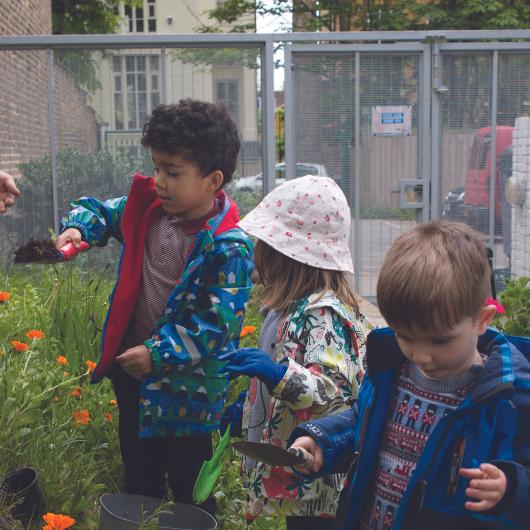 Children gardening in the nursery garden