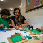 Playing with toy trees at LEYF Children's Garden Nursery