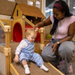 LEYF Marsham Street baby coming down the slide