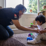 Caring for a child at LEYF London Fields Nursery