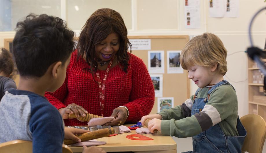 Staff and Child playing with playdough