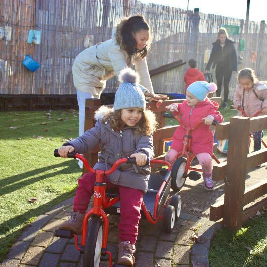 Children ride bikes in the playground