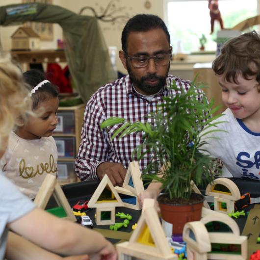 male staff and children enjoying a provocation