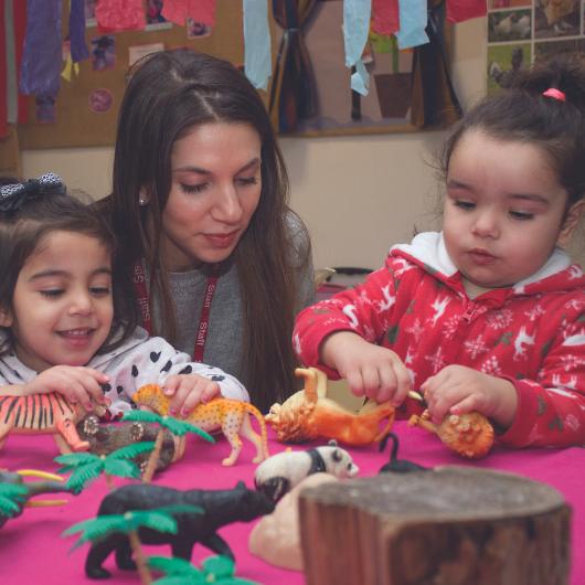 children playing with small plastic animals