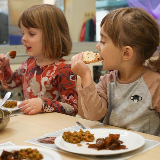 Children sitting down for their lunch meal