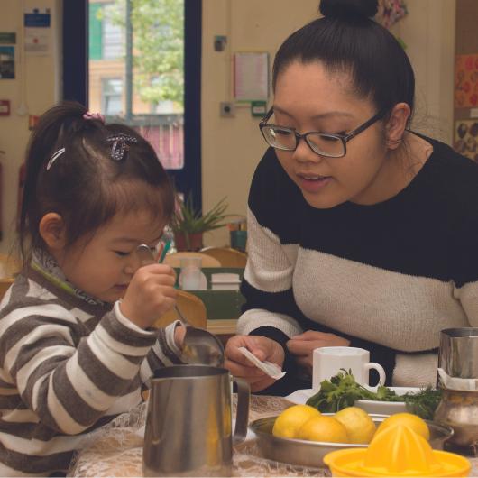 staff and children having a tea party and exploring the different flavours and smells of tea