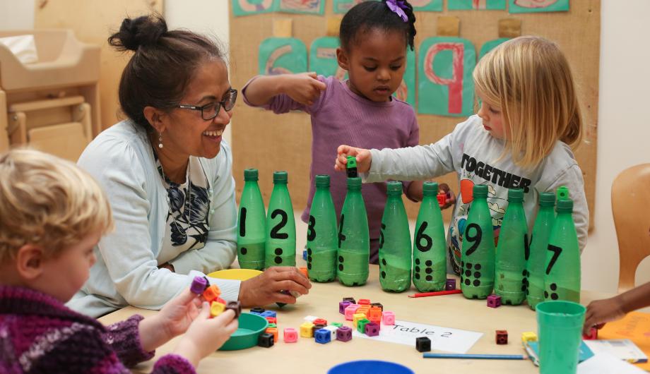 Staff and Children using creative ways to count