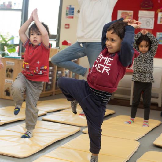 children doing yoga together