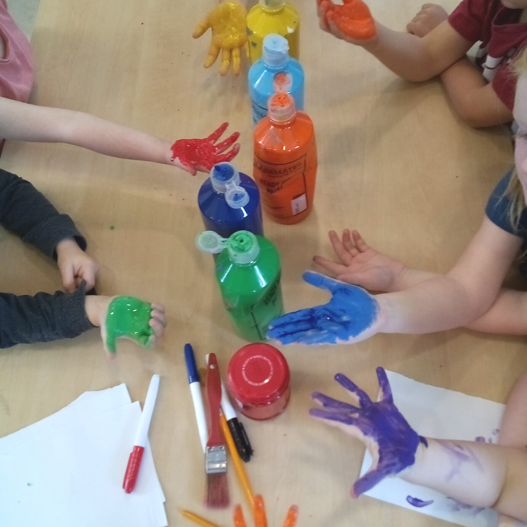 Photo of children with paint on their hands