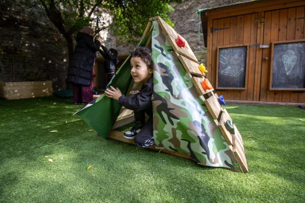 Playing in a tent at LEYF Angel Nursery