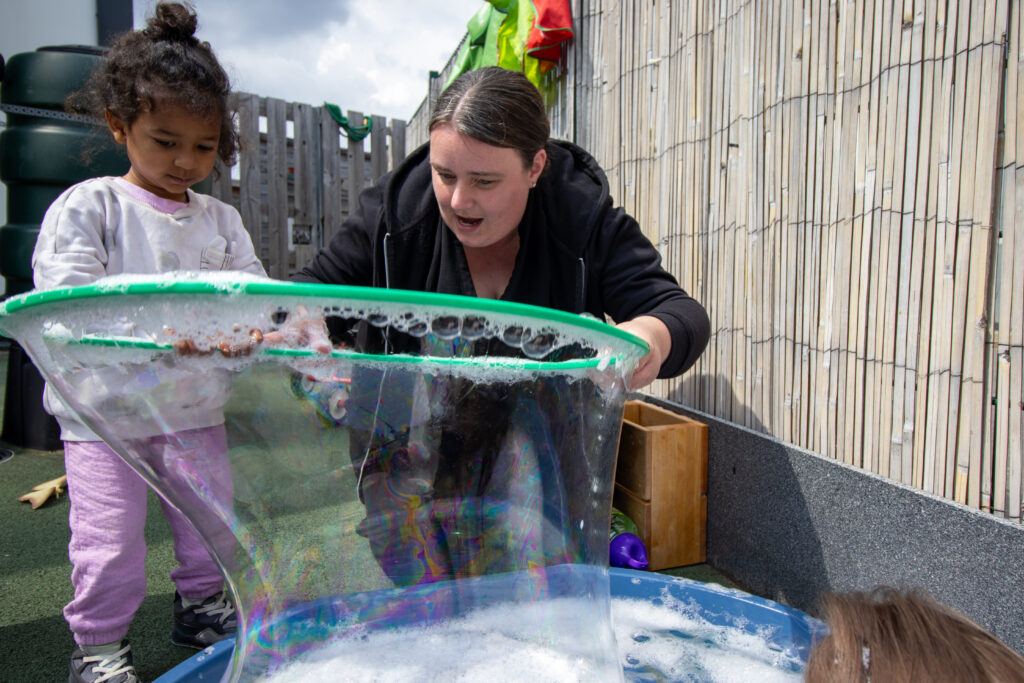Playing with bubbles at LEYF Barking Nursery