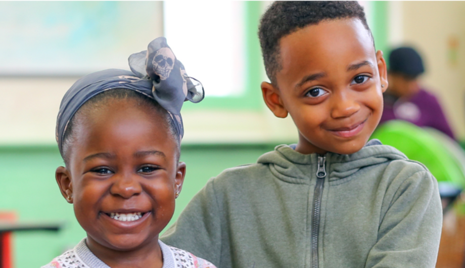 Two children smiling