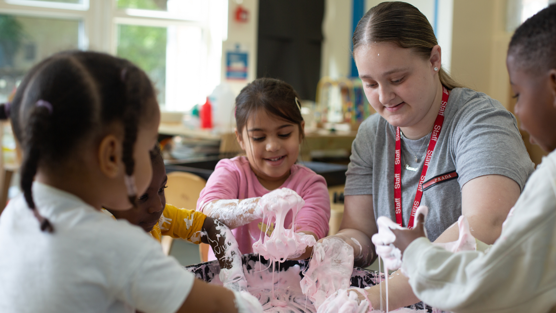 staff and children enjoying messy play with slime