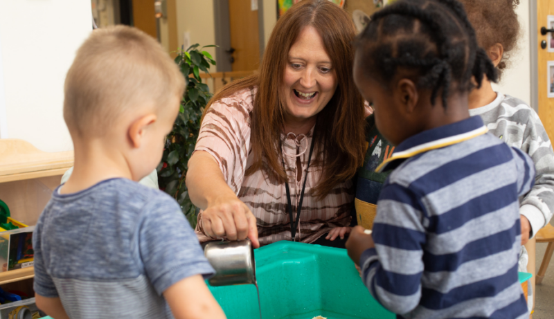 Nursery manager pouring mud or chocolate into a cup or bowl