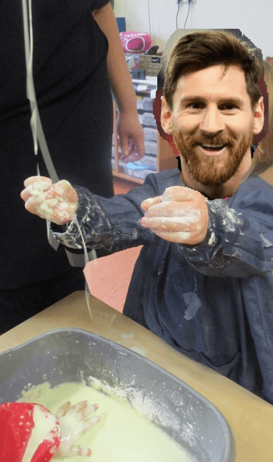 Child playing with cornflour slime but with Lionel Messi's face photoshopped over their face