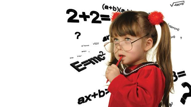 Image of a thoughtful child biting a pencil wearing oversized glasses with a background of algebra