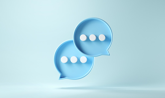 Stock image of two speech bubbles containing ellipses