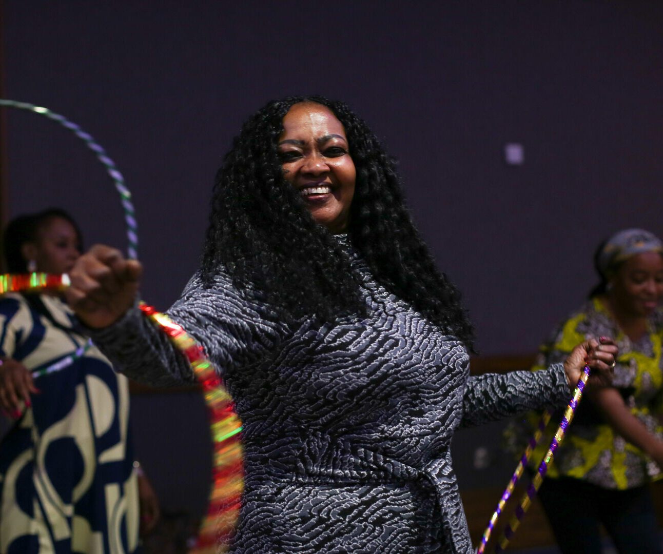 Staff spinning hula-hoops around