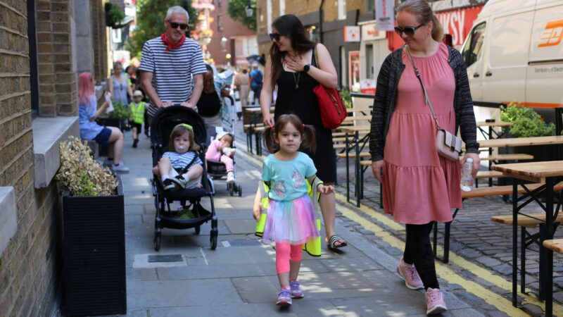 Parents and children walking together on a trip