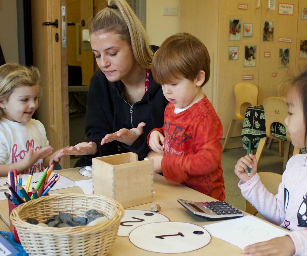 Staff and children learning how to count