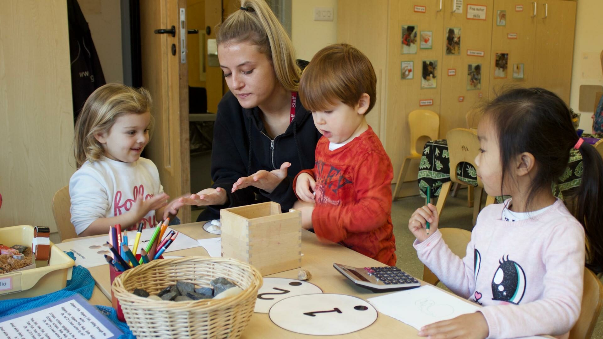 Staff and children learning how to count