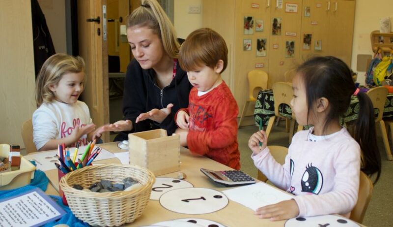 Staff and children learning how to count