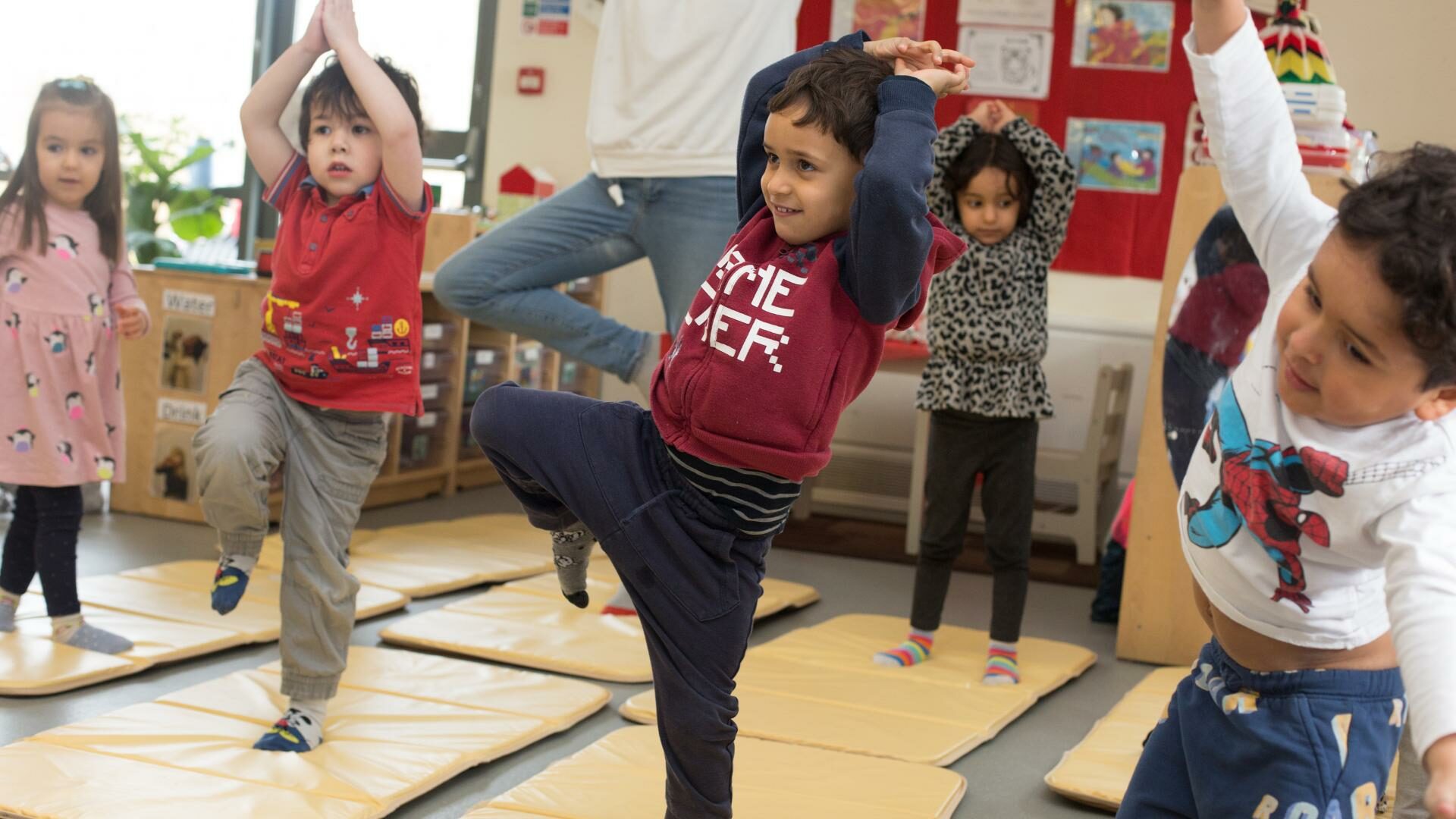 children doing yoga together