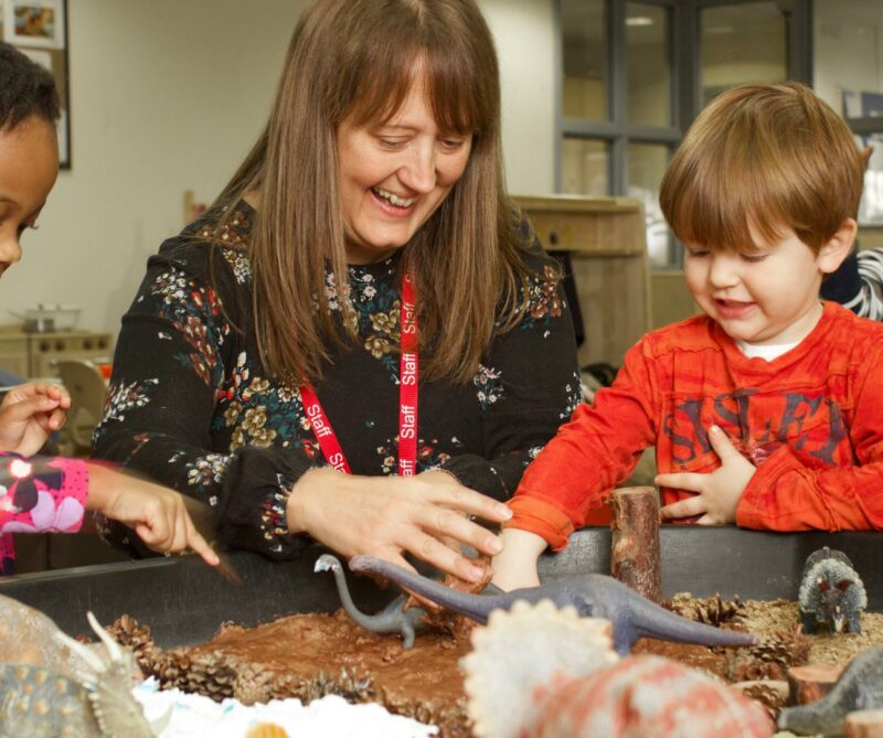 Children and teacher playing with animal provocation