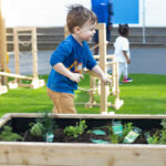 A child running across garden