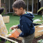 A child watering plants
