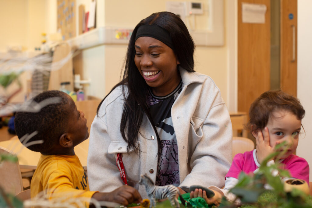 Teacher smiling at a child