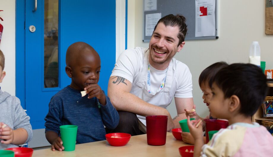 Snack time with a male teacher