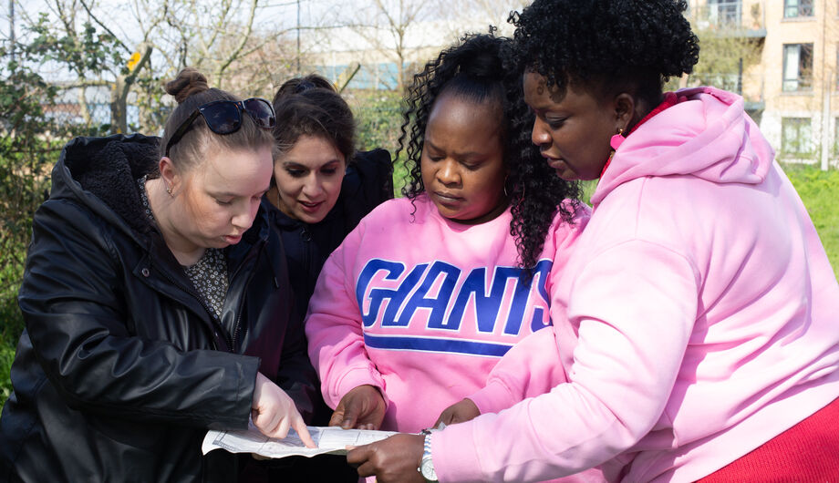 Team reading instructions to complete a task outdoors