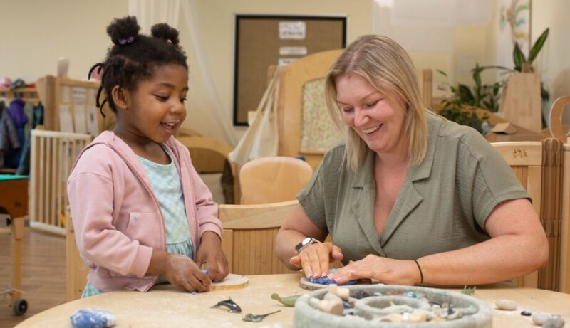 Beads and playdough activity Siobhan Barking Riverside nursery Teacher with child doing activity