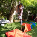 Children exploring the outdoors at LEYF Uxbridge Nursery and Pre-School