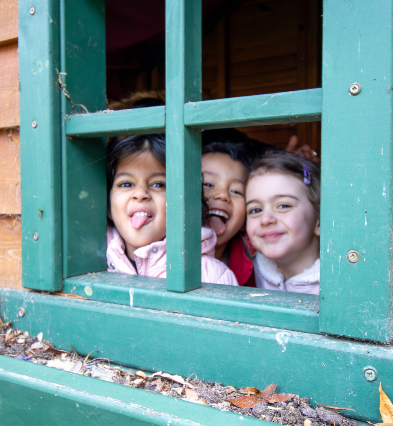 Nestles Nursery children playing in shed
